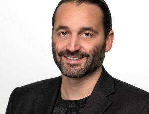 Man with beard and moustache in suit