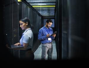 Man and women in a data center