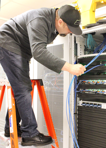 A man pulling wires.