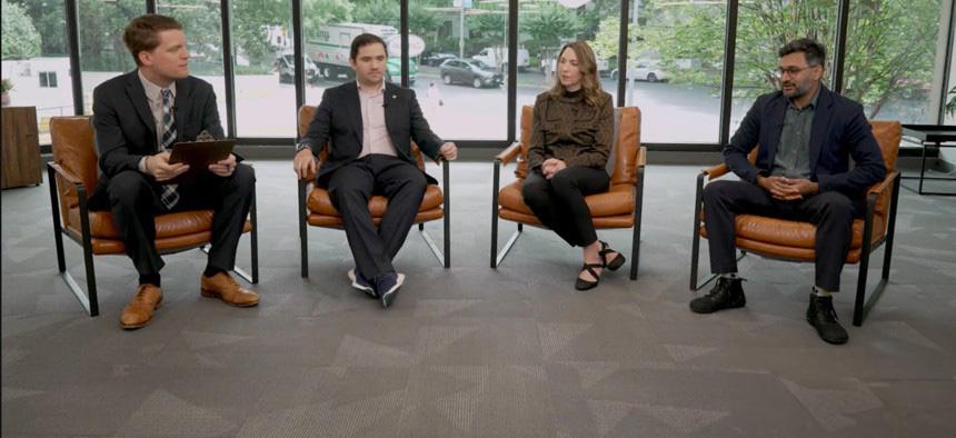 Four people sitting in chairs