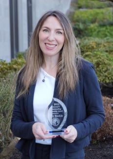 Woman holding an award