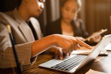 Man pointing at laptop