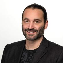 Man with beard and moustache in suit