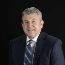 Man in suit smiling